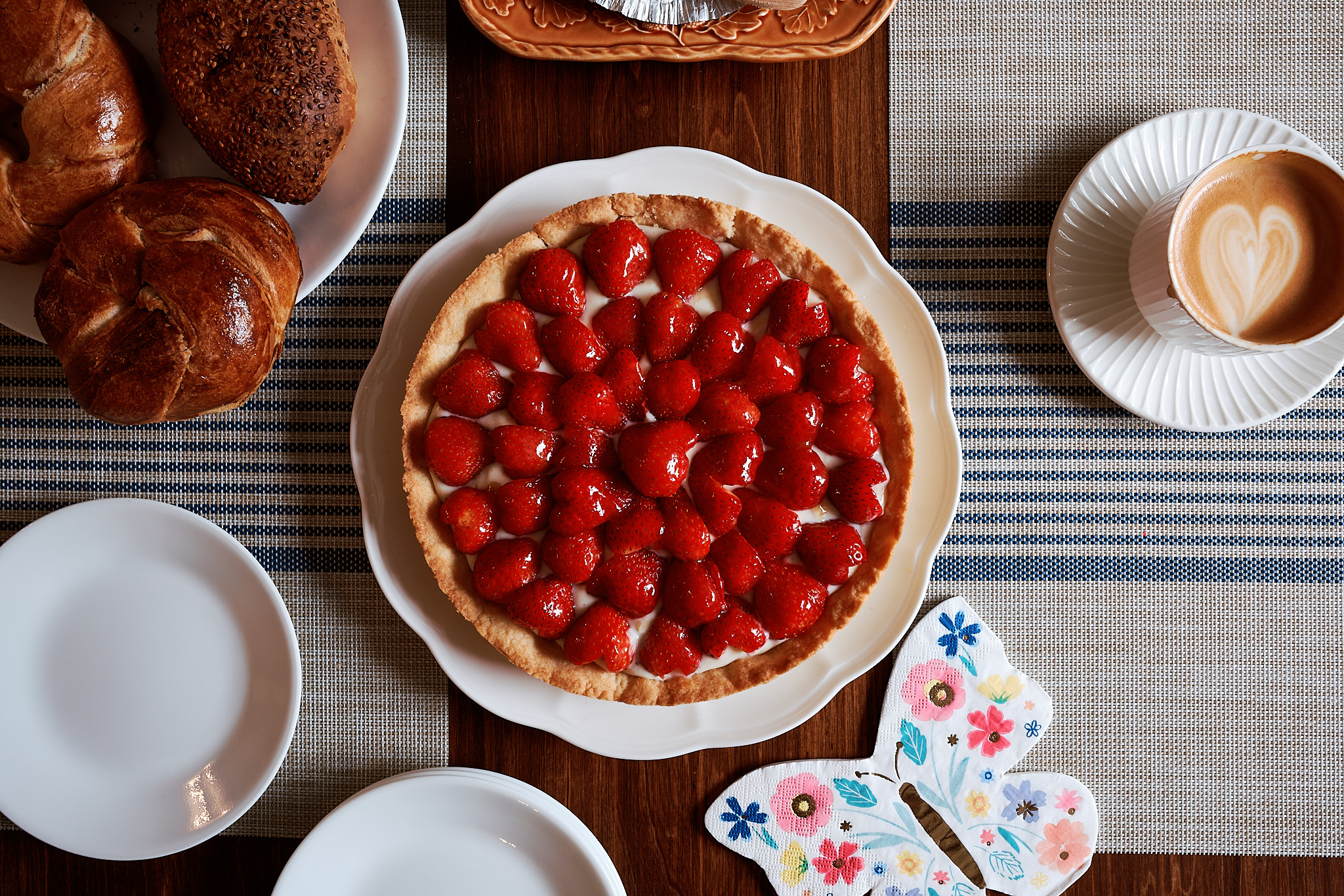 Fujifilm X-T5 SDR JPEG looking down at a strawberry tart, coffee, and breakfast table.