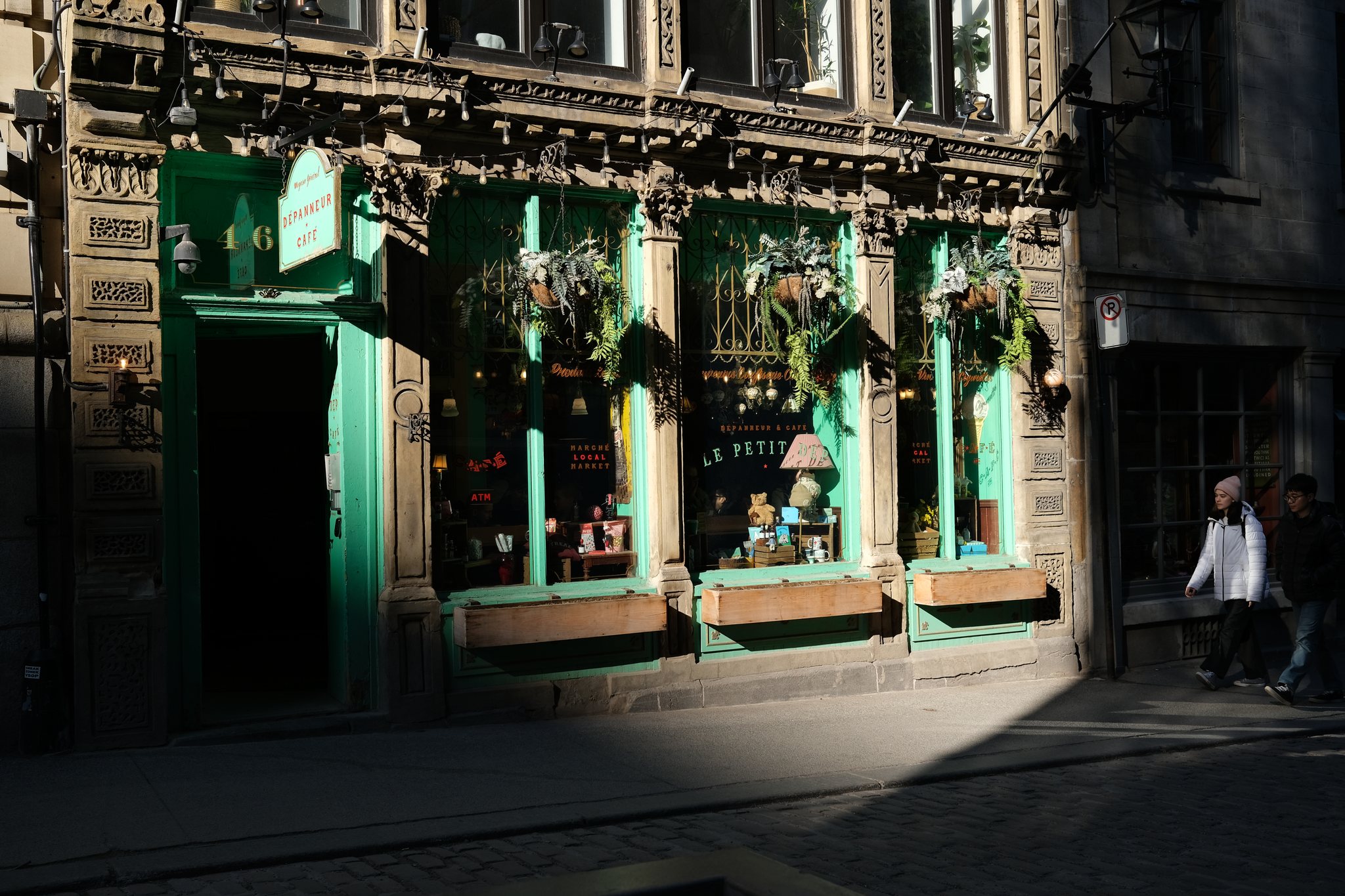 Fujifilm X100V Web HDR export of the same storefront with brighter sunlight, window reflections, and preserved Provia color.